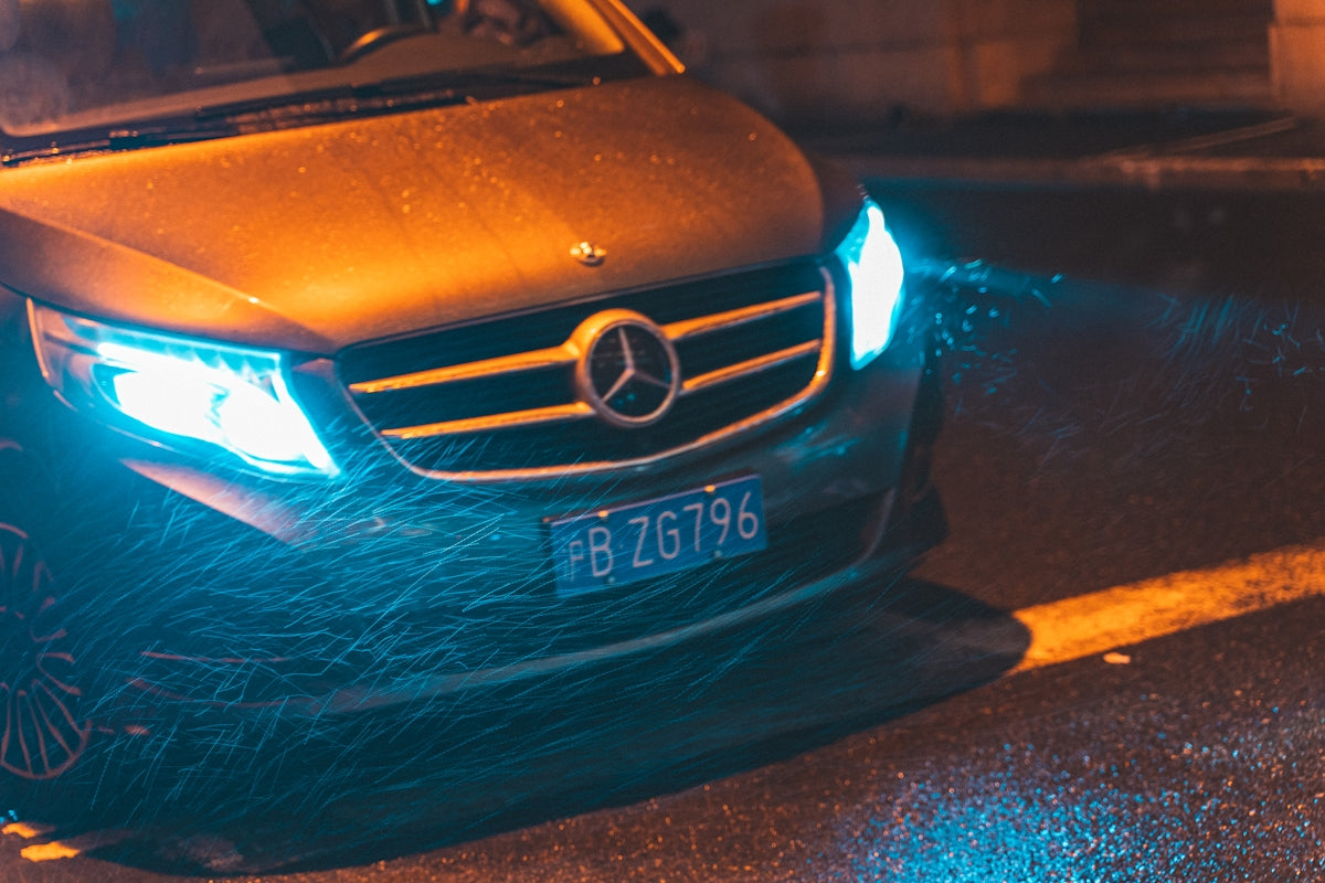 black Mercedes-Benz car on road