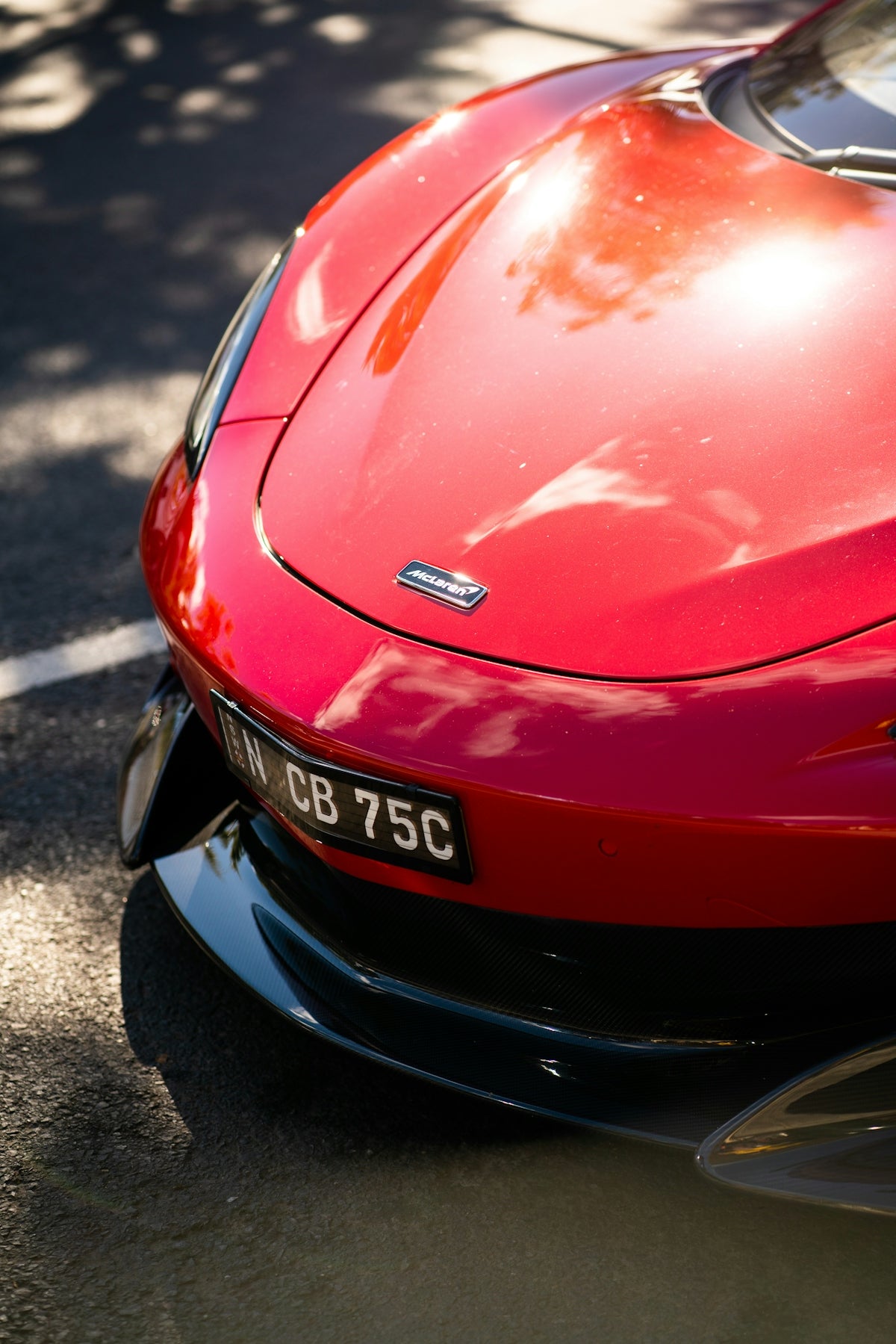 red honda car on road during daytime