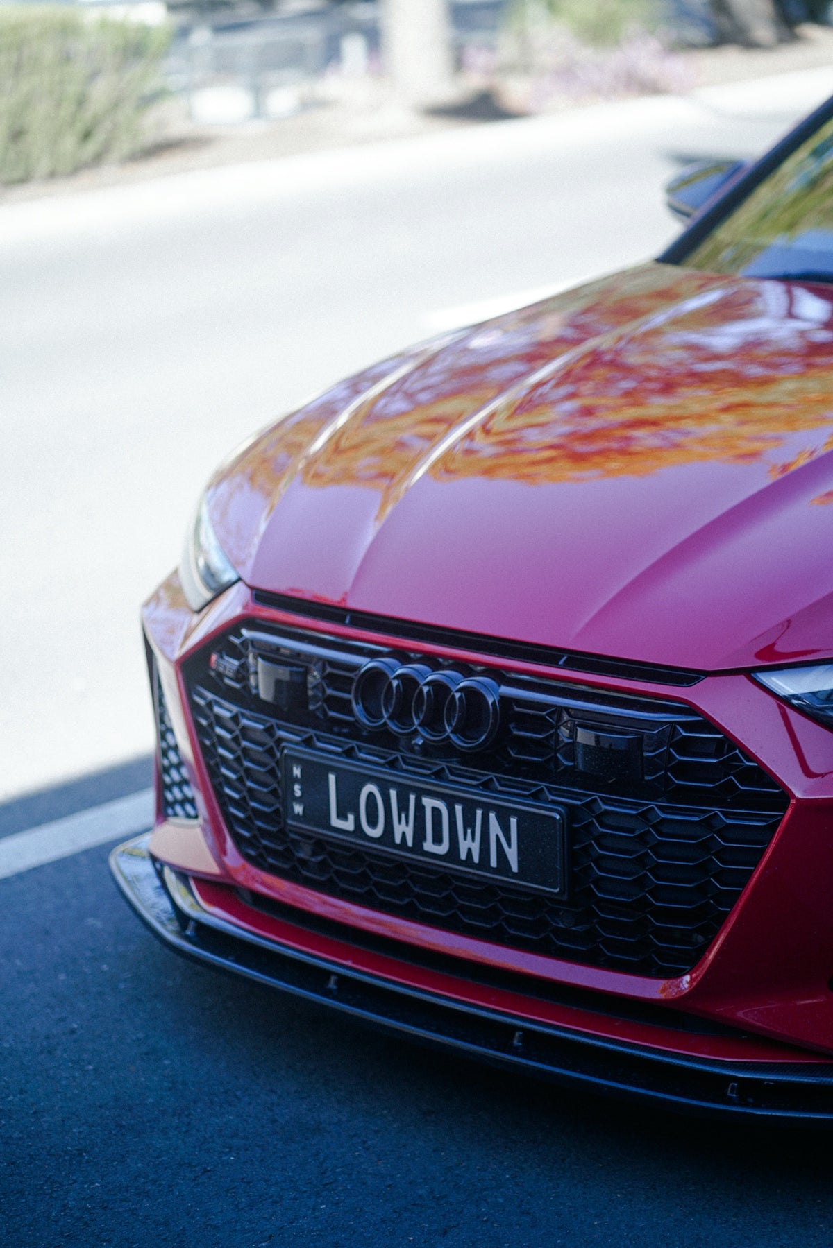 a red car parked on the side of the road