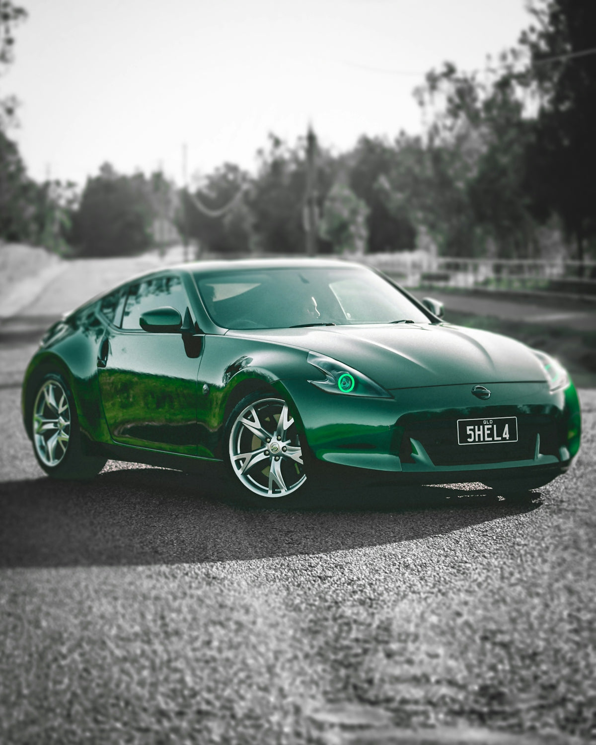 a green sports car parked in a parking lot