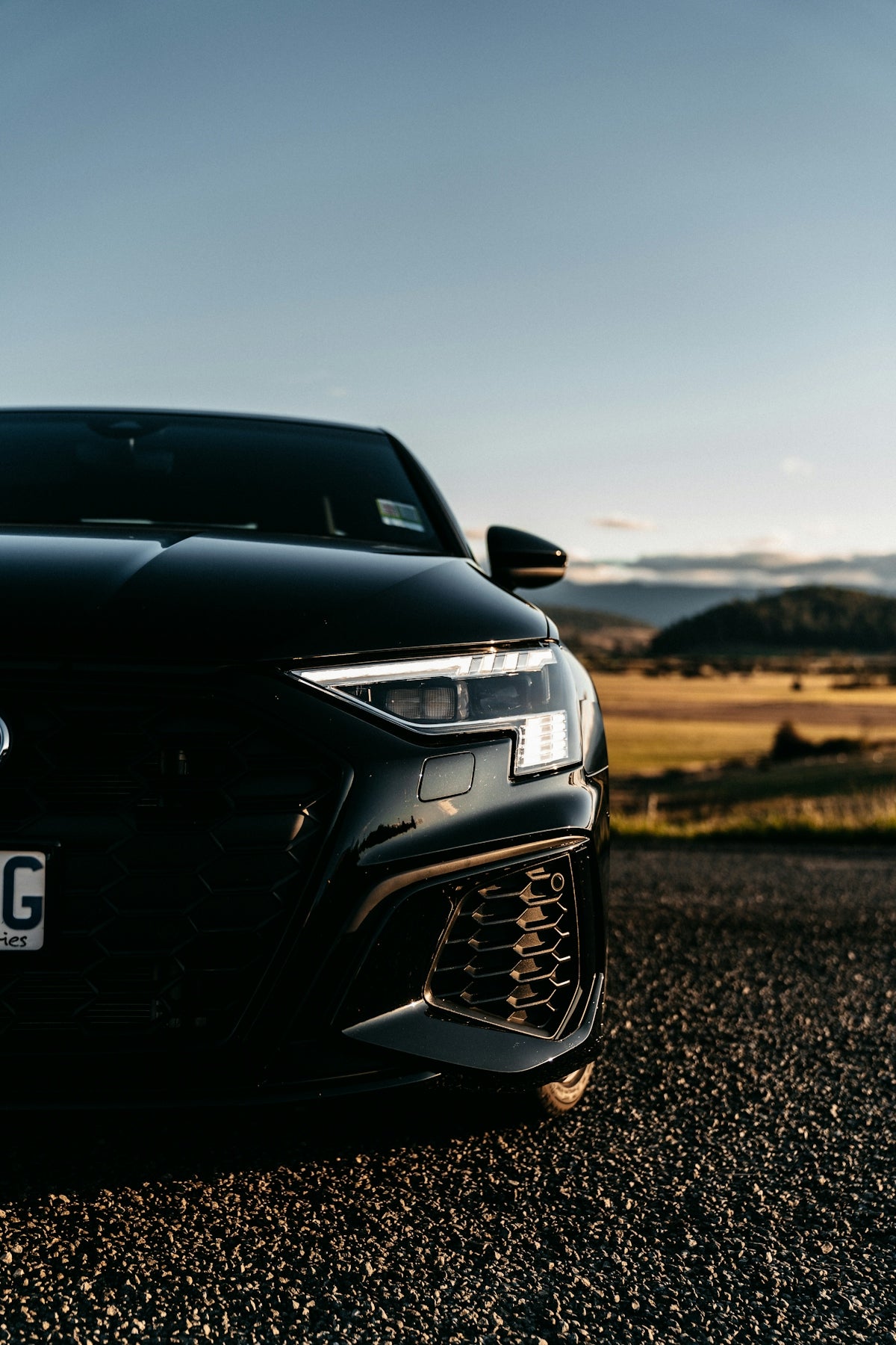 a black sports car parked on the side of the road