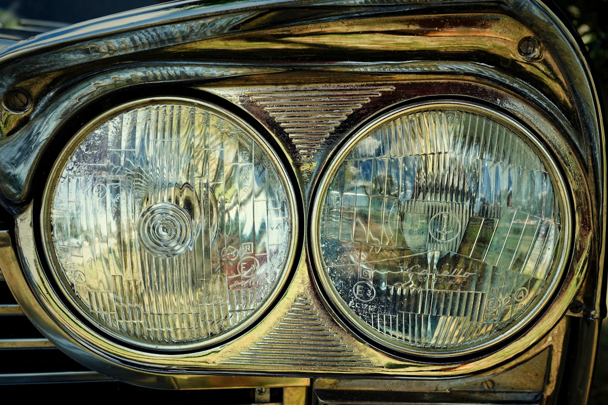 A close up of the headlights of a car