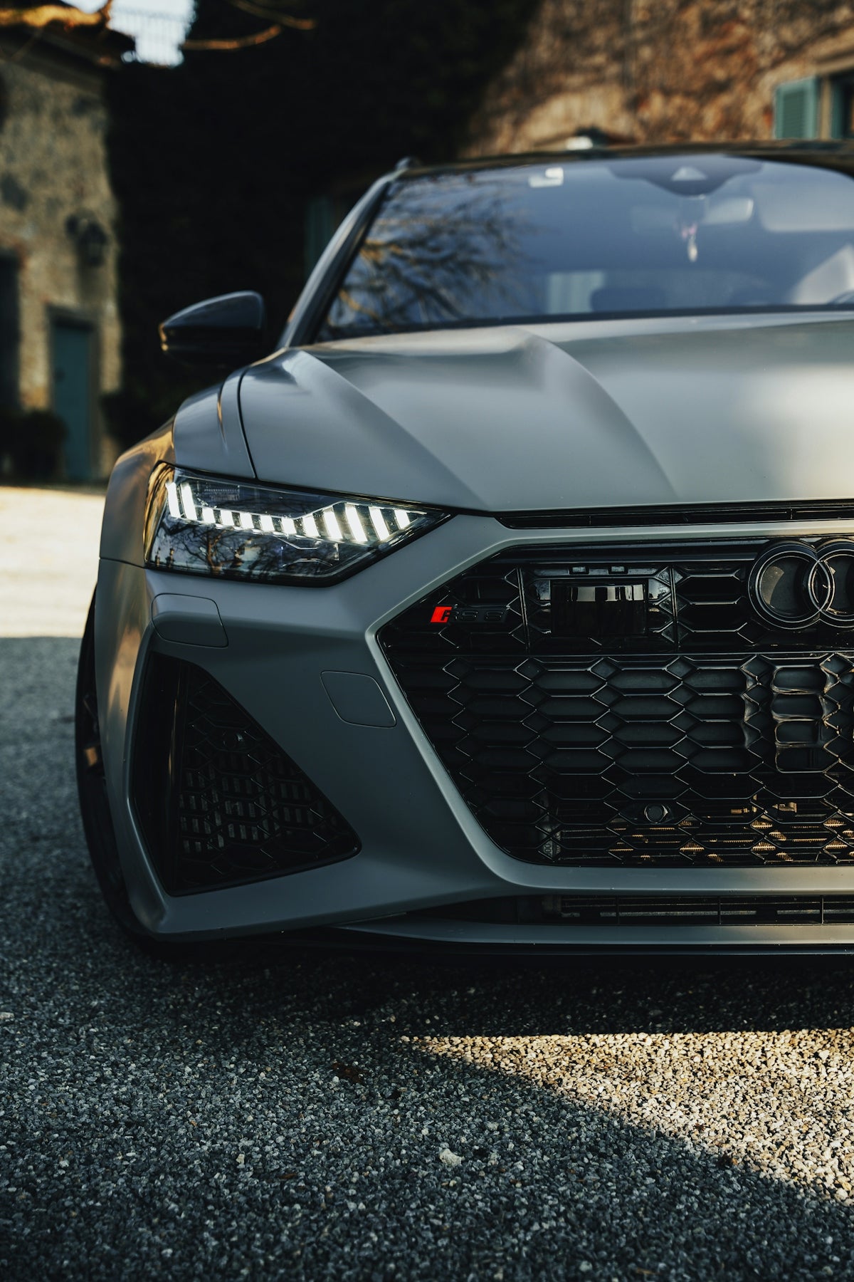 A gray audi rs 6 car is parked outside