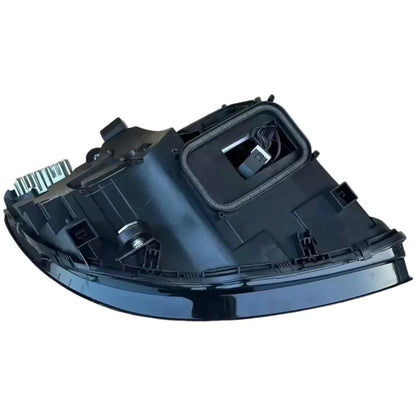 Rear view of a reconditioned Mercedes C-Class W205 headlight, black housing, wiring exposed